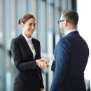 Business man and woman shaking hands